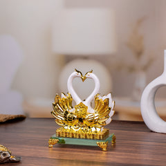 Sleek White and Golden Swan Statue