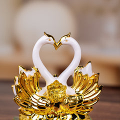 Sleek White and Golden Swan Statue
