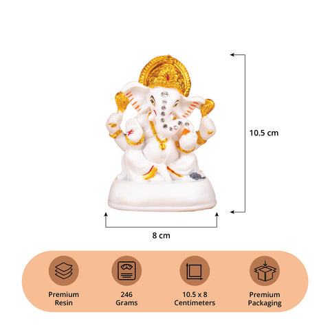 Golden and White Ganesh Statue with Stones