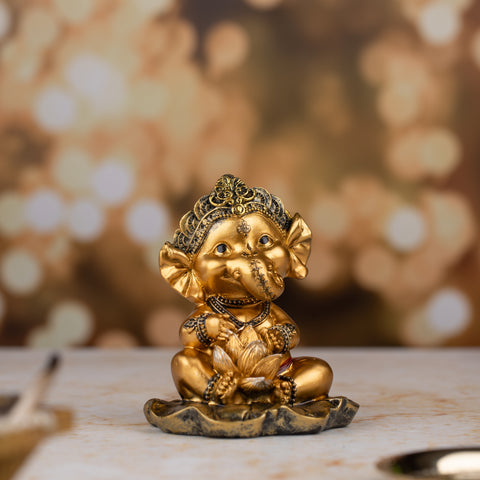 Golden Baby Ganesh with Flower Figurine |Golden Bloom statue