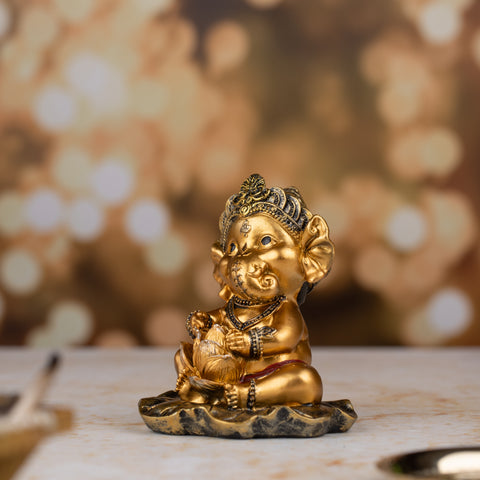 Golden Baby Ganesh with Flower Figurine |Golden Bloom statue